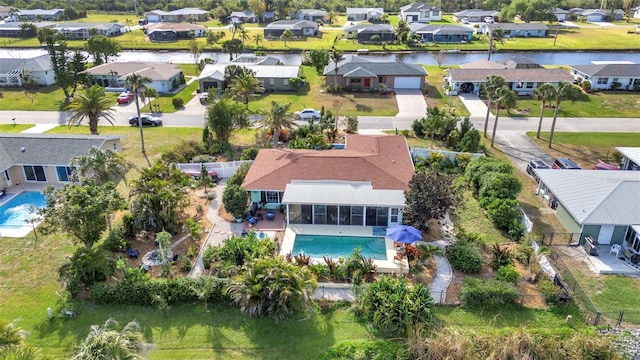 aerial view of residential area with a pool