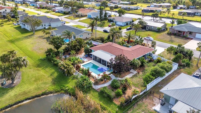 aerial view of residential area featuring a pool