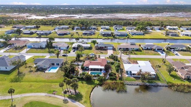 aerial view of residential area with a large body of water