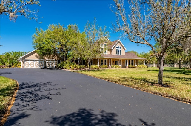 9990 SW Peace River St, Arcadia, FL 34269 - view of front of home with a porch and asphalt driveway
