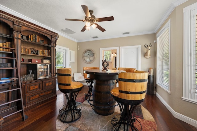 9990 SW Peace River St, Arcadia, FL 34269 - bar area with dark wood finished floors, a ceiling fan, healthy amount of natural light, and ornamental molding
