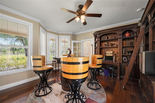 9990 SW Peace River St, Arcadia, FL 34269 - bar area featuring dark wood-style flooring, ceiling fan, and crown molding