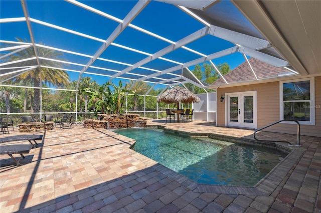 9990 SW Peace River St, Arcadia, FL 34269 - swimming pool featuring french doors, a patio, and a lanai