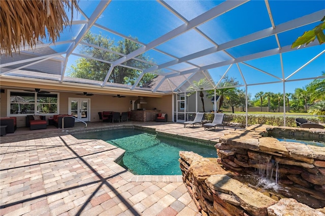 9990 SW Peace River St, Arcadia, FL 34269 - swimming pool with ceiling fan, an outdoor living space, a patio, and glass enclosure