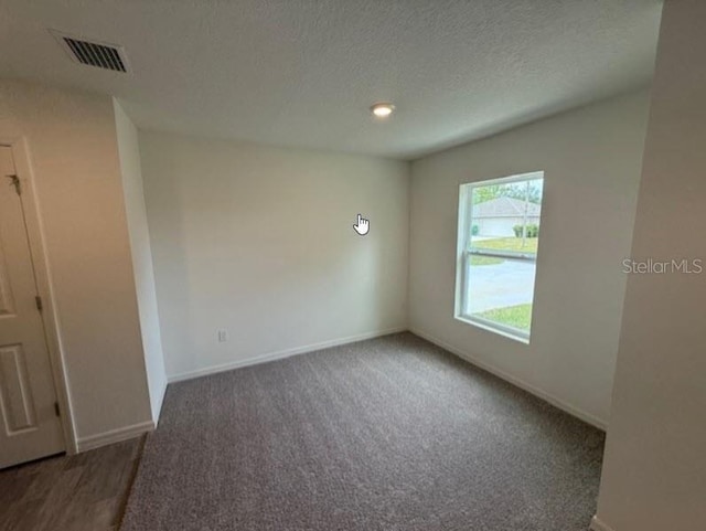 12 Royal Leaf Ln, Palm Coast, FL 32164 - unfurnished room with carpet flooring, baseboards, and visible vents