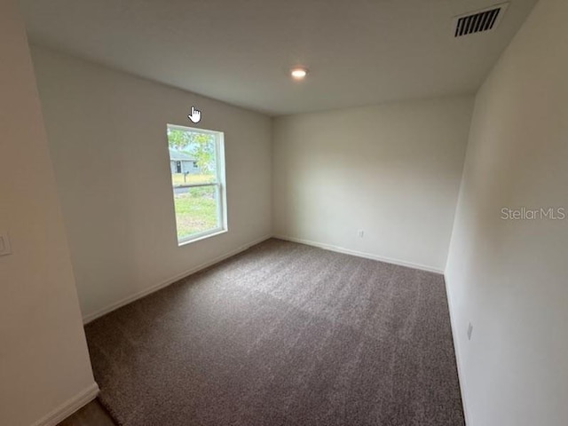 12 Royal Leaf Ln, Palm Coast, FL 32164 - spare room featuring carpet floors, baseboards, and visible vents
