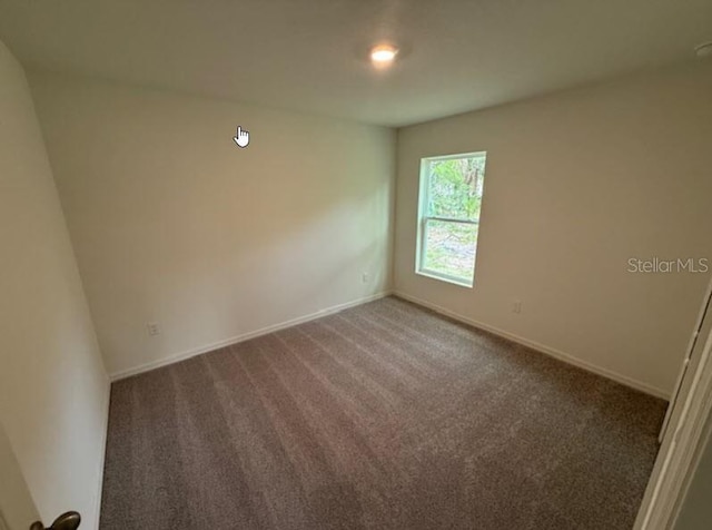 12 Royal Leaf Ln, Palm Coast, FL 32164 - carpeted spare room featuring baseboards