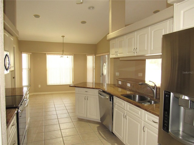 kitchen with white cabinetry, light tile patterned floors, a sink, and stainless steel appliances