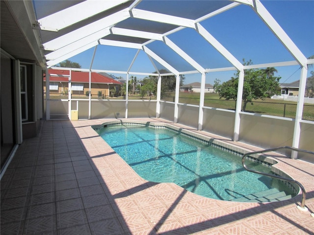 pool with a lanai and a patio