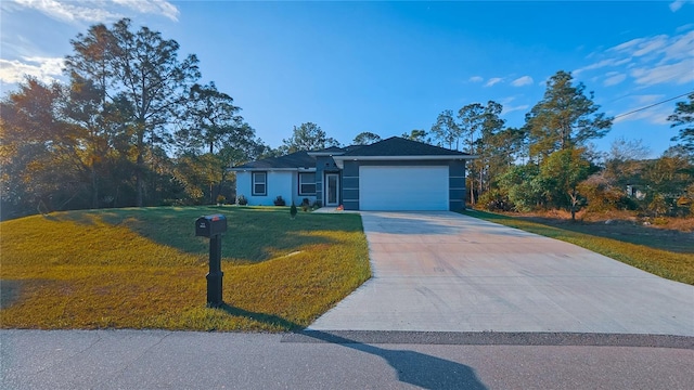 ranch-style house with driveway, stucco siding, a garage, and a front yard