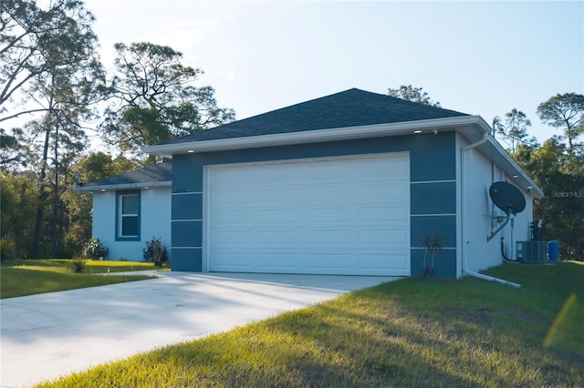 exterior space with a front yard, concrete driveway, central air condition unit, stucco siding, and an attached garage