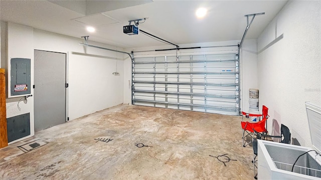 garage with electric panel and a garage door opener