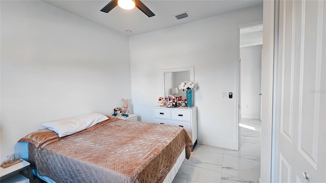bedroom featuring marble finish floor, baseboards, ceiling fan, and visible vents