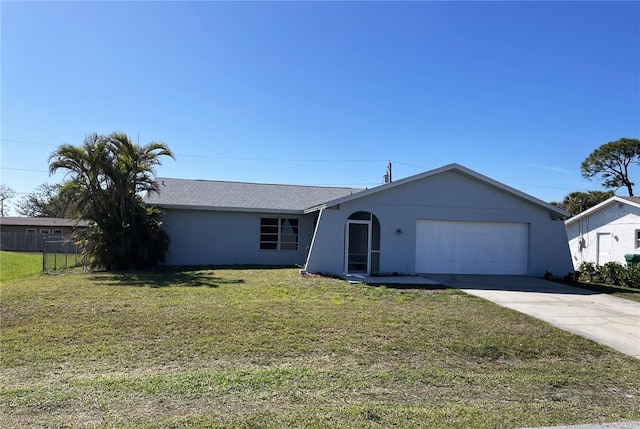 single story home with stucco siding, an attached garage, a front lawn, and concrete driveway