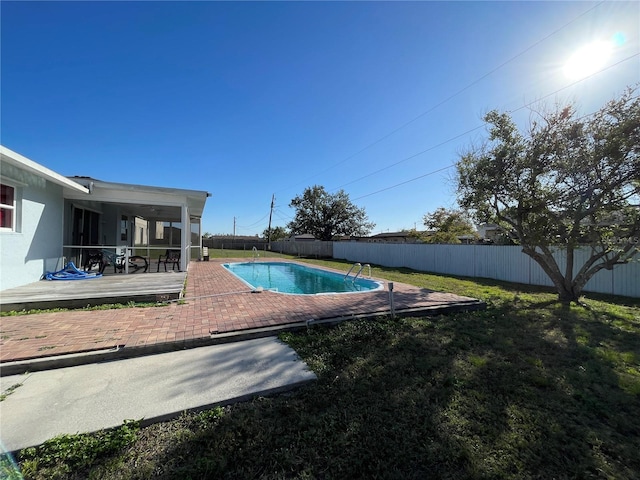 view of pool featuring a lawn, a fenced in pool, a fenced backyard, and a patio