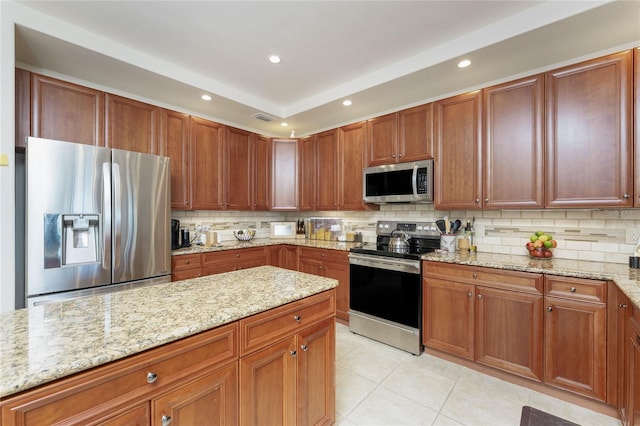 kitchen featuring visible vents, decorative backsplash, appliances with stainless steel finishes, and light tile patterned floors