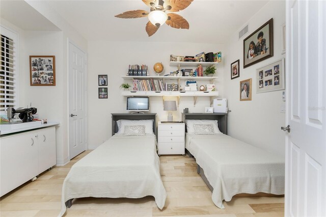 bedroom with visible vents, a ceiling fan, and light wood-type flooring