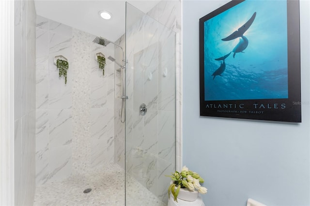 full bathroom featuring a marble finish shower