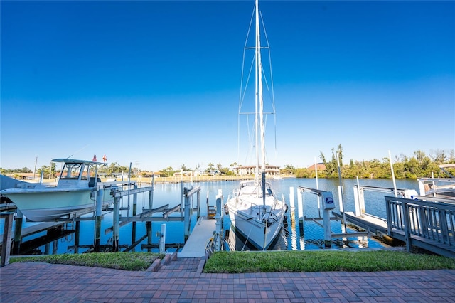 view of dock with boat lift and a water view