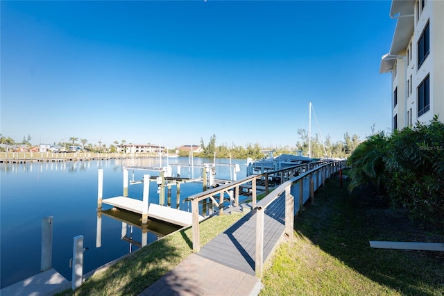 view of dock with boat lift and a water view
