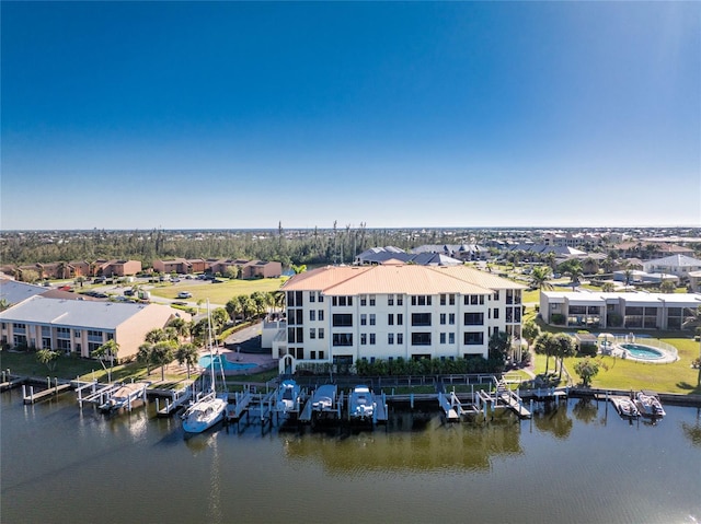 aerial view featuring a residential view and a water view