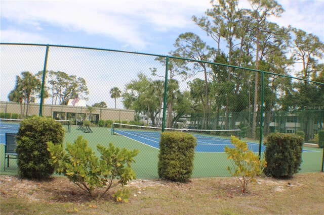 21320 Brinson Ave Unit 212, Port Charlotte, FL 33952 - view of sport court featuring fence