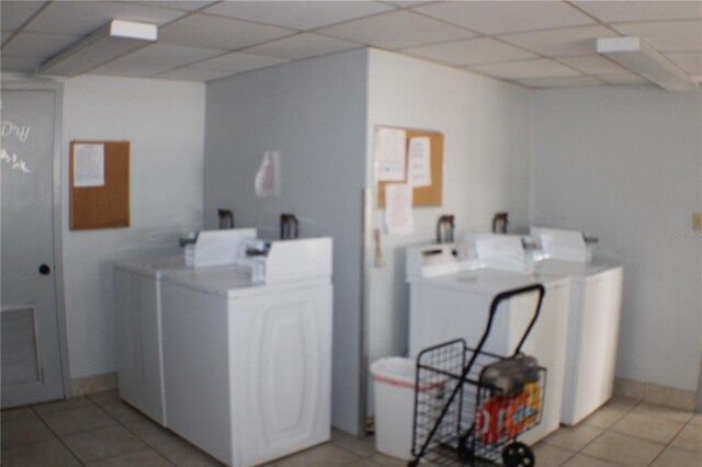 21320 Brinson Ave Unit 212, Port Charlotte, FL 33952 - shared laundry area with washer and dryer and light tile patterned floors