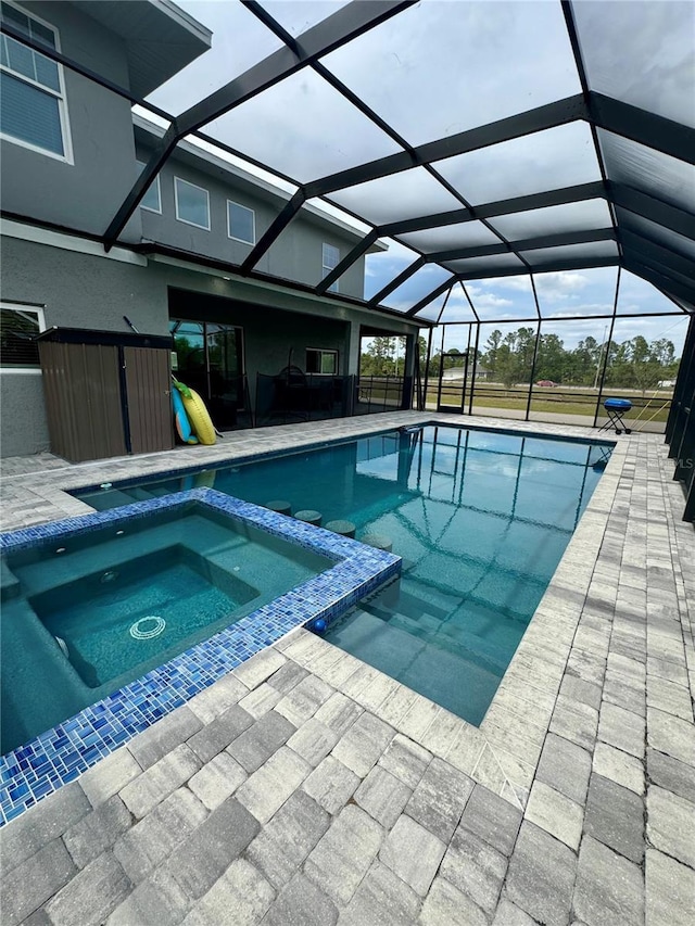 22223 Seyburn Ter, Port Charlotte, FL 33954 - view of swimming pool featuring a patio area, a pool with connected hot tub, and glass enclosure