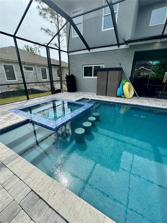 22223 Seyburn Ter, Port Charlotte, FL 33954 - view of pool featuring a pool with connected hot tub, a patio area, and glass enclosure