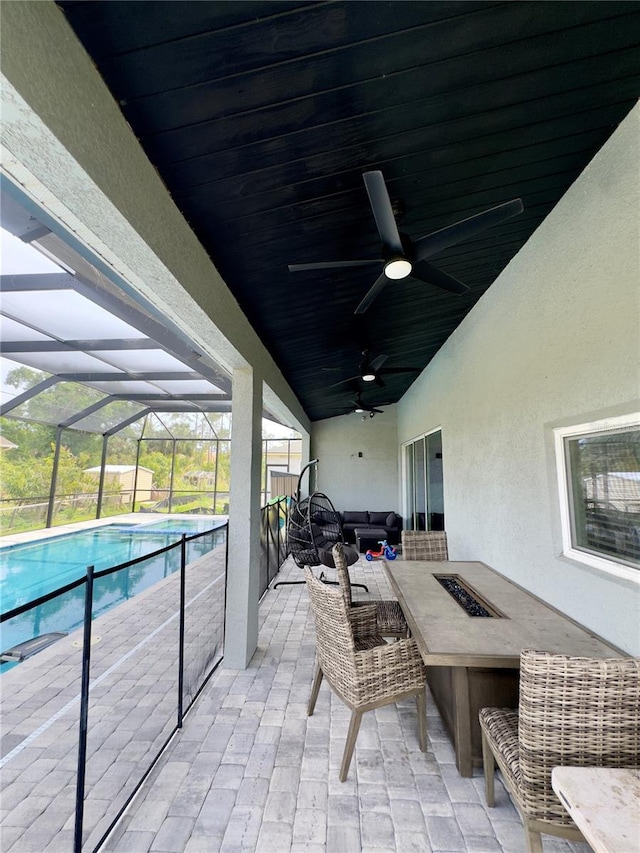 22223 Seyburn Ter, Port Charlotte, FL 33954 - view of patio featuring an outdoor pool, a lanai, an outdoor living space with a fire pit, and ceiling fan