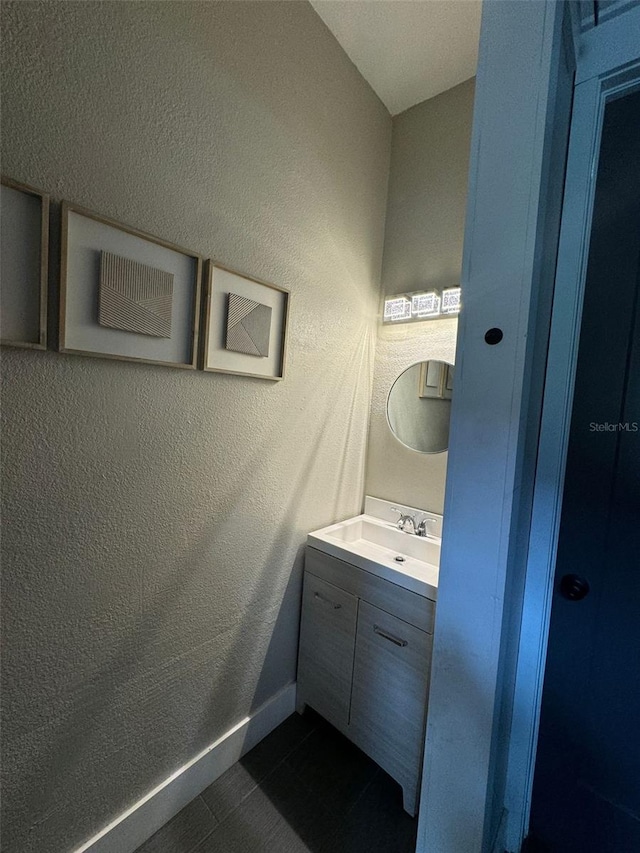 22223 Seyburn Ter, Port Charlotte, FL 33954 - bathroom featuring vanity, baseboards, and a textured wall