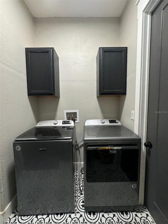 22223 Seyburn Ter, Port Charlotte, FL 33954 - clothes washing area with separate washer and dryer and cabinet space