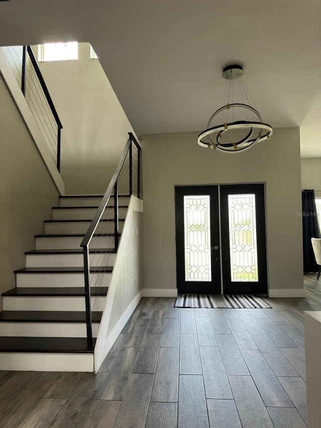 22223 Seyburn Ter, Port Charlotte, FL 33954 - foyer featuring a chandelier, stairs, baseboards, and dark wood finished floors