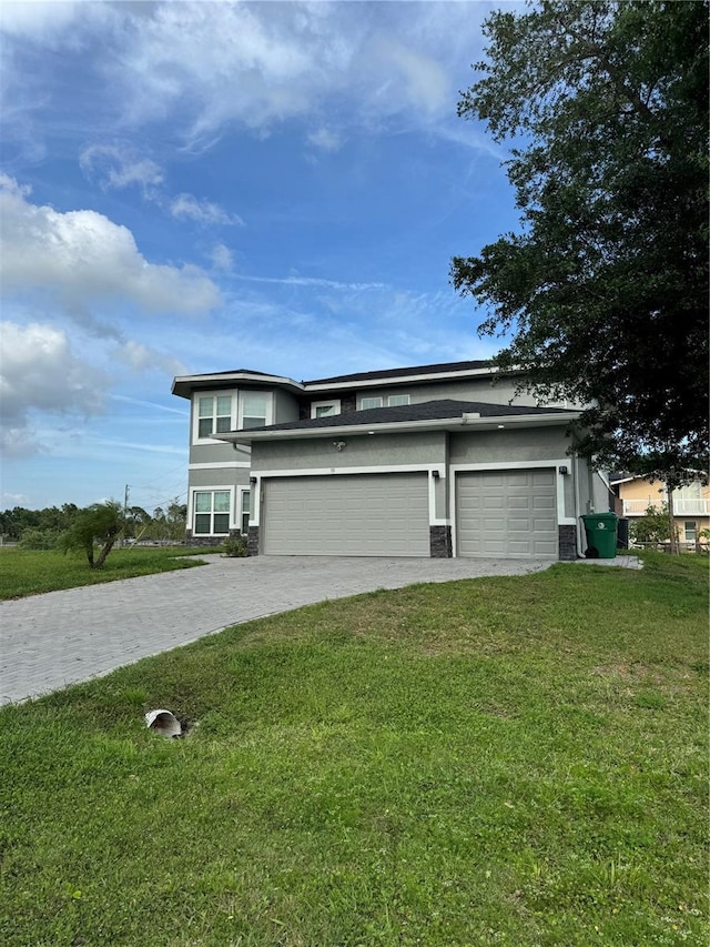 22223 Seyburn Ter, Port Charlotte, FL 33954 - view of front of home featuring a front yard, an attached garage, driveway, and stucco siding