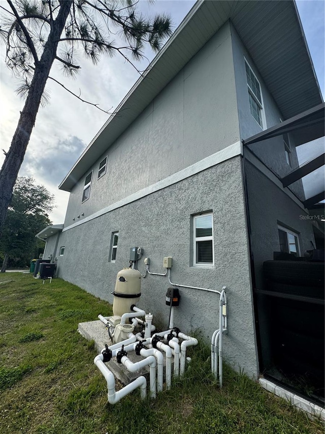 22223 Seyburn Ter, Port Charlotte, FL 33954 - view of property exterior with a lawn and stucco siding