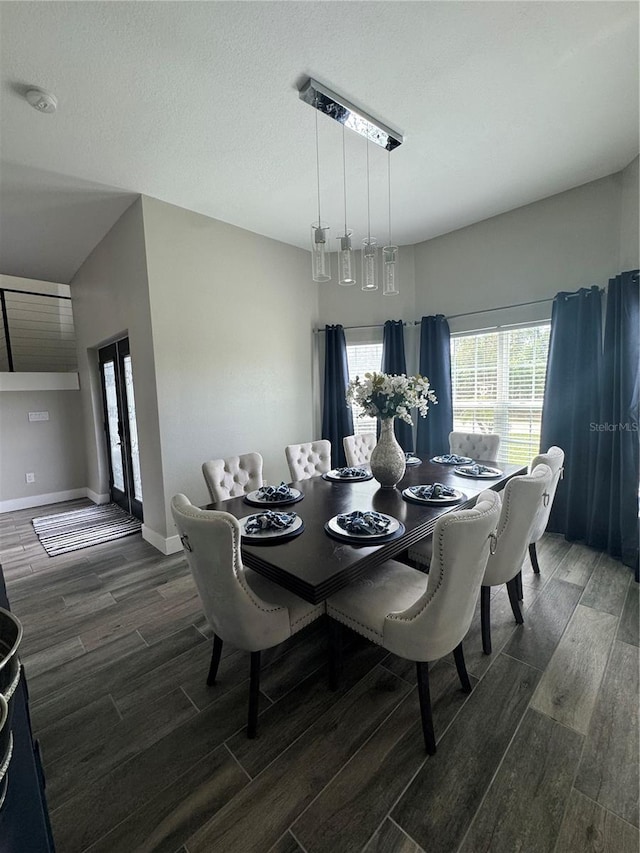 22223 Seyburn Ter, Port Charlotte, FL 33954 - dining space featuring dark wood-style flooring, baseboards, and a textured ceiling