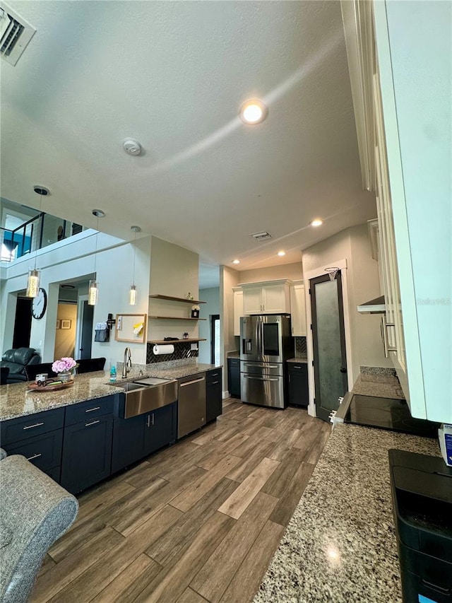 22223 Seyburn Ter, Port Charlotte, FL 33954 - kitchen featuring visible vents, white cabinets, a sink, stainless steel appliances, and dark wood-type flooring