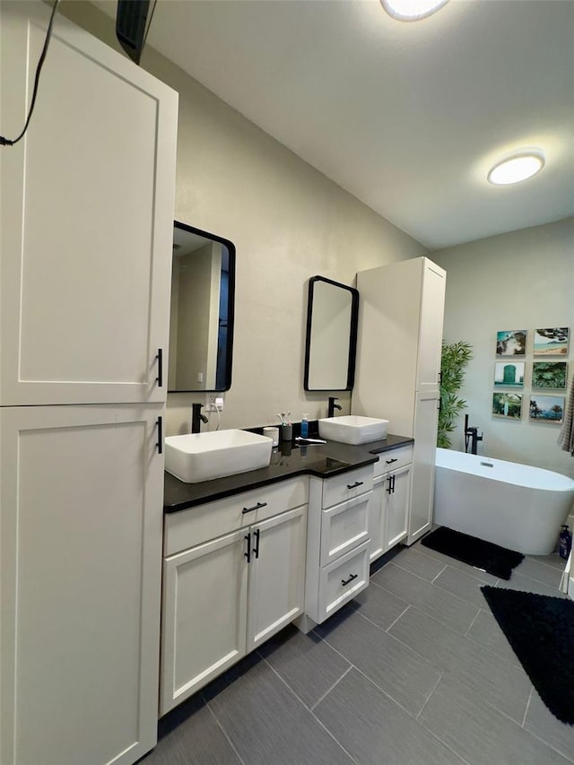 22223 Seyburn Ter, Port Charlotte, FL 33954 - full bath with double vanity, a sink, and a soaking tub