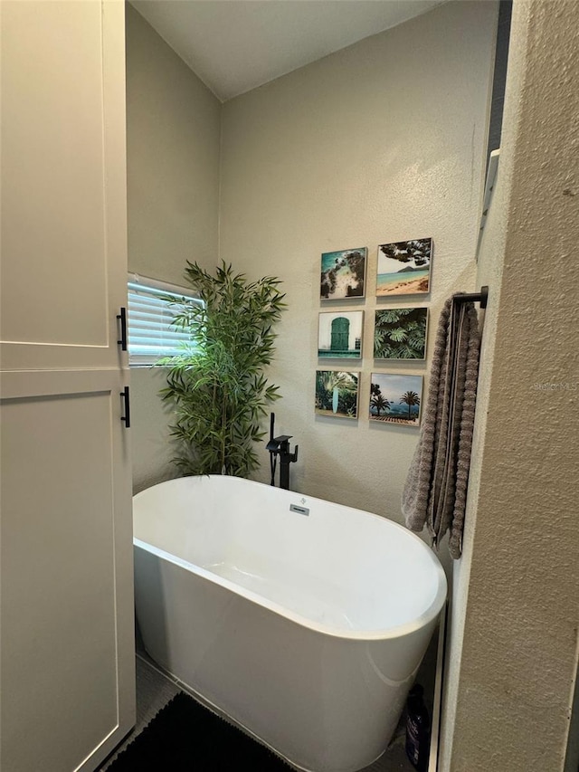 22223 Seyburn Ter, Port Charlotte, FL 33954 - full bathroom featuring a textured wall and a soaking tub