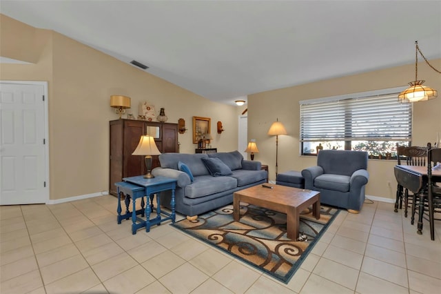 4420 Larkspur Ct, Port Charlotte, FL 33948 - living area featuring light tile patterned floors, baseboards, lofted ceiling, and visible vents