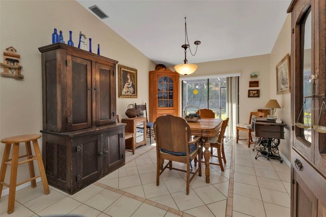 4420 Larkspur Ct, Port Charlotte, FL 33948 - dining space featuring baseboards, lofted ceiling, visible vents, and light tile patterned floors