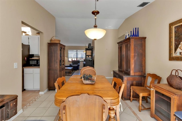 4420 Larkspur Ct, Port Charlotte, FL 33948 - dining area featuring vaulted ceiling, visible vents, baseboards, and light tile patterned floors
