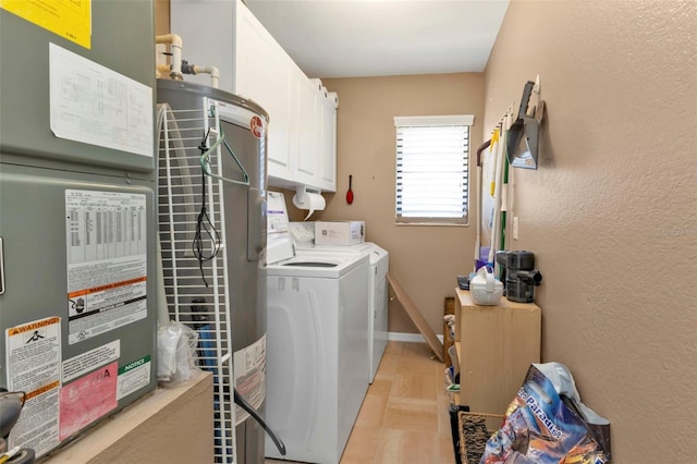 4420 Larkspur Ct, Port Charlotte, FL 33948 - laundry area featuring independent washer and dryer, baseboards, heating unit, cabinet space, and a textured wall