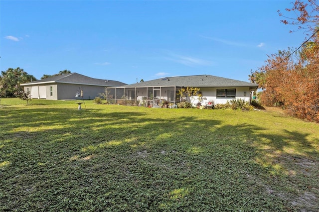 4420 Larkspur Ct, Port Charlotte, FL 33948 - rear view of property with stucco siding, a sunroom, and a yard