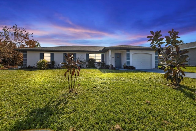 4420 Larkspur Ct, Port Charlotte, FL 33948 - single story home featuring stucco siding, an attached garage, a lawn, and driveway