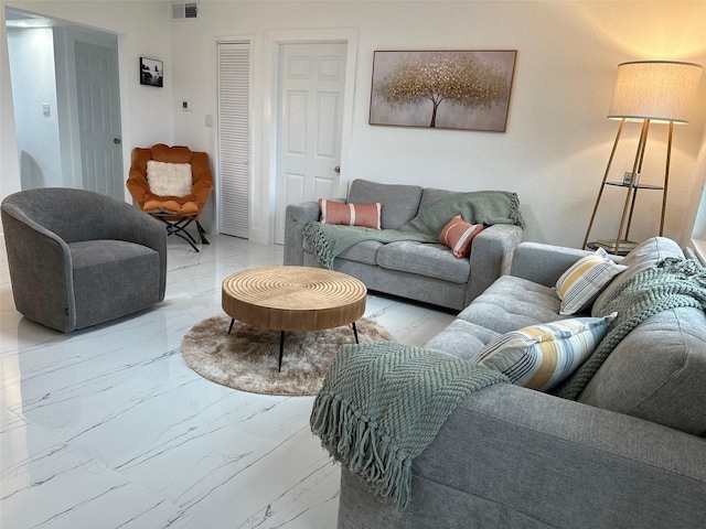 living room featuring marble finish floor