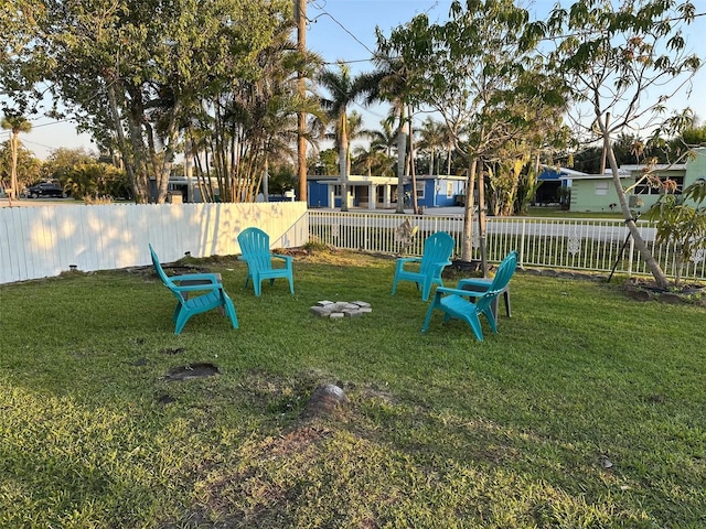 view of playground with a lawn and fence
