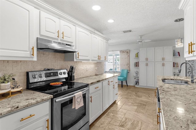 4168 Harbor Blvd, Port Charlotte, FL 33952 - kitchen with a ceiling fan, a sink, stainless steel range with electric cooktop, white cabinets, and under cabinet range hood