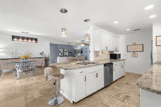 4168 Harbor Blvd, Port Charlotte, FL 33952 - kitchen with dishwasher, visible vents, a sink, black microwave, and ceiling fan
