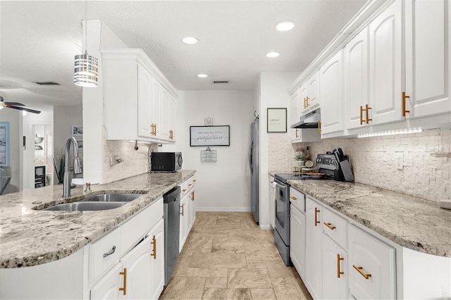 4168 Harbor Blvd, Port Charlotte, FL 33952 - kitchen featuring white cabinets, under cabinet range hood, visible vents, a sink, and appliances with stainless steel finishes